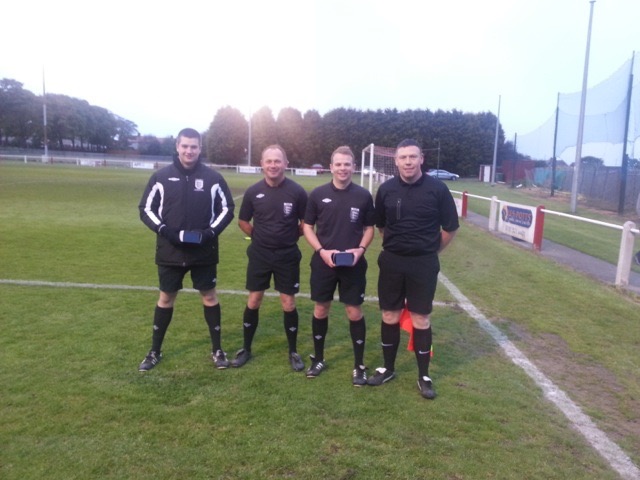Match officials for the Total Sport Trophy Referee James Simpson. Assistants Mick Crowe Gary Hills and David Fairley