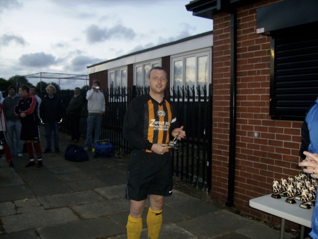RICHARD ANDERSON RECIEVING THE SJR MAN OF THE MATCH TROPHY